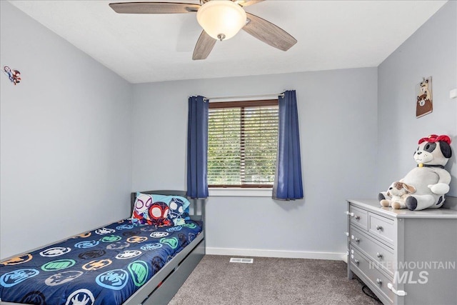 6495 S Mistyglen Ave, Boise, ID 83709 - bedroom with dark carpet, a ceiling fan, and baseboards