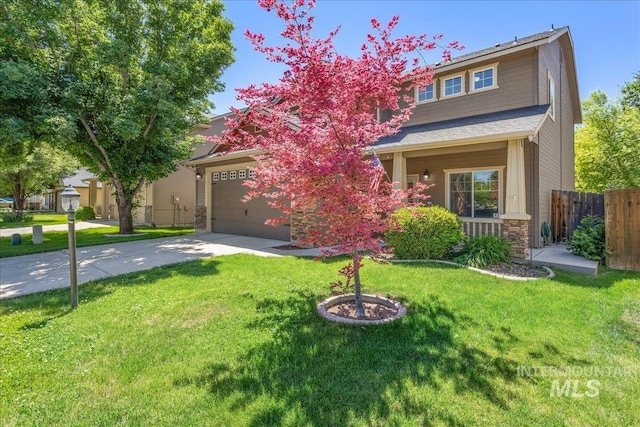 6495 S Mistyglen Ave, Boise, ID 83709 - view of front of home featuring driveway, stone siding, and a garage