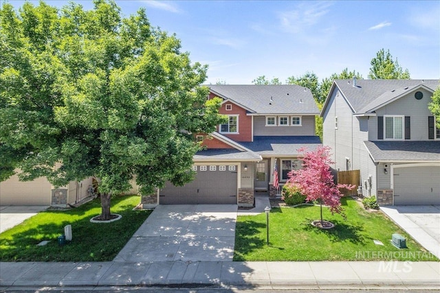 6495 S Mistyglen Ave, Boise, ID 83709 - craftsman-style house featuring stone siding, concrete driveway, a garage, and a front lawn