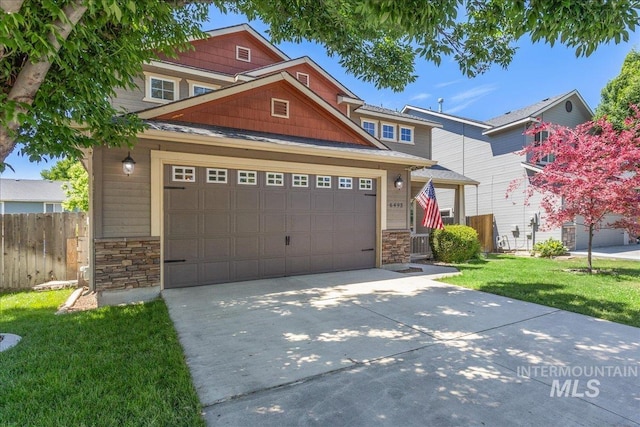 6495 S Mistyglen Ave, Boise, ID 83709 - craftsman-style home featuring stone siding and concrete driveway