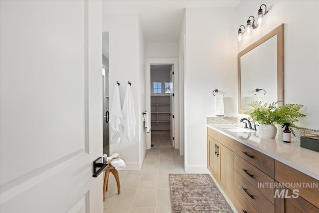 bathroom featuring tile patterned floors and vanity