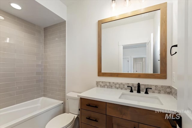 bathroom with toilet and vanity