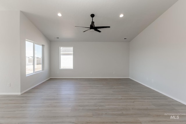 unfurnished room featuring lofted ceiling, recessed lighting, light wood-style floors, and ceiling fan