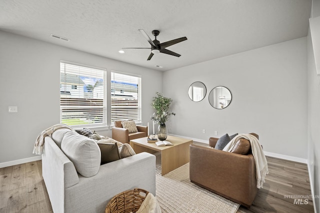 10061 W La Jolla Dr, Boise, ID 83709 - living room with a ceiling fan, wood finished floors, and recessed lighting