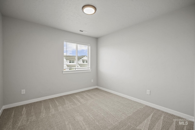 10061 W La Jolla Dr, Boise, ID 83709 - spare room featuring carpet flooring and baseboards
