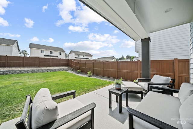 10061 W La Jolla Dr, Boise, ID 83709 - fenced backyard featuring outdoor lounge area, a patio area, and a residential view