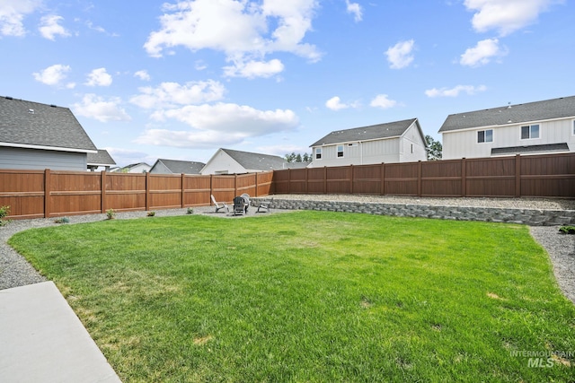 10061 W La Jolla Dr, Boise, ID 83709 - fenced backyard with a residential view and a fire pit
