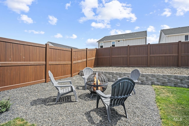 10061 W La Jolla Dr, Boise, ID 83709 - fenced backyard featuring an outdoor fire pit