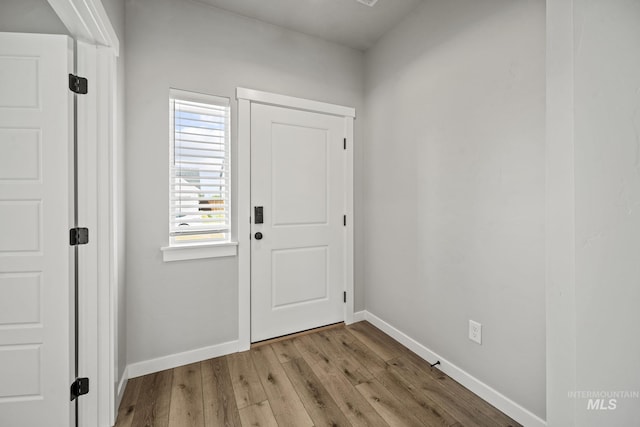 10061 W La Jolla Dr, Boise, ID 83709 - foyer featuring wood finished floors and baseboards