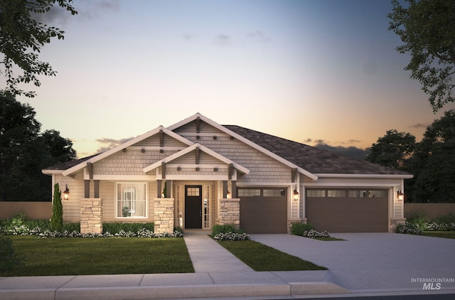 craftsman inspired home with stone siding, an attached garage, concrete driveway, and a front lawn