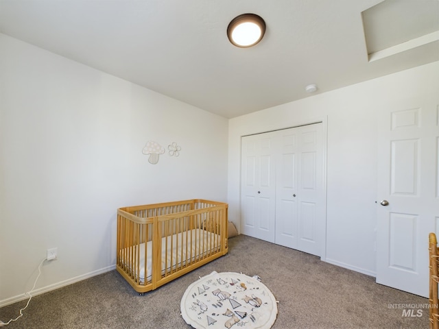 bedroom with carpet flooring, a closet, and a nursery area