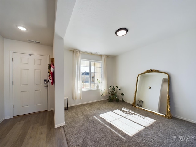 foyer entrance with dark hardwood / wood-style flooring