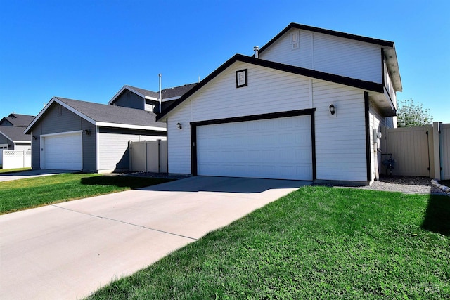 ranch-style home featuring a garage, fence, driveway, and a front lawn