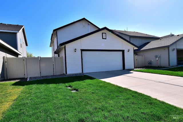 ranch-style home with a garage, a gate, concrete driveway, and a front lawn