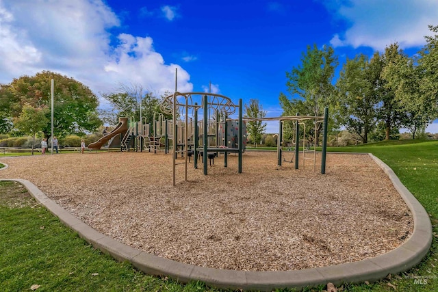 community jungle gym with a yard
