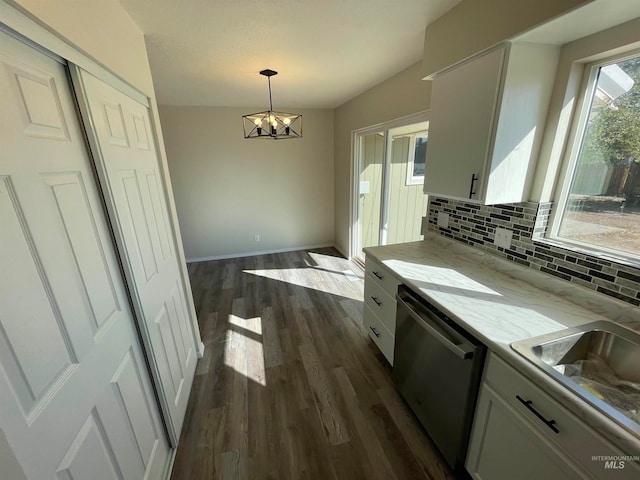 kitchen featuring white cabinetry, dark wood-type flooring, tasteful backsplash, dishwasher, and decorative light fixtures