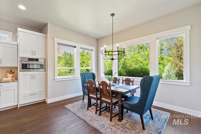 2165 N Luge Ave, Eagle, ID 83616 - dining area featuring baseboards, plenty of natural light, a chandelier, dark wood-type flooring, and recessed lighting
