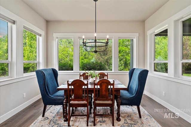 2165 N Luge Ave, Eagle, ID 83616 - dining room with a chandelier, baseboards, and wood finished floors