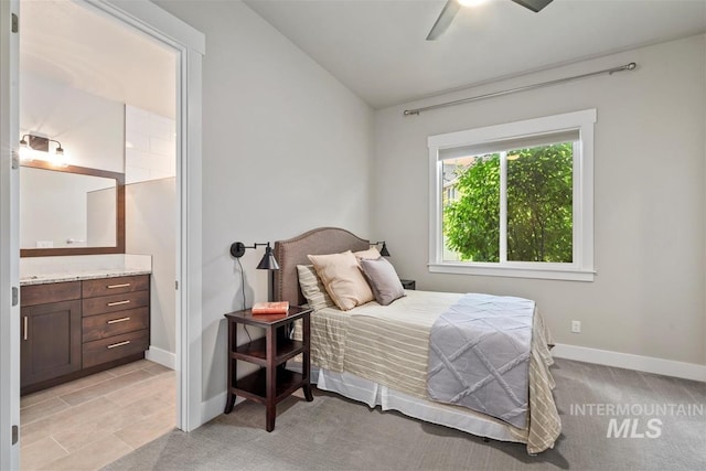 2165 N Luge Ave, Eagle, ID 83616 - bedroom featuring baseboards, ensuite bath, light colored carpet, and a ceiling fan