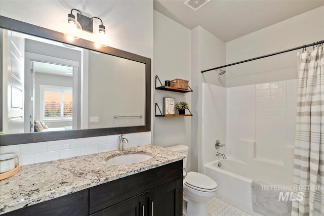 2165 N Luge Ave, Eagle, ID 83616 - full bath featuring toilet, shower / bath combination with curtain, vanity, tasteful backsplash, and tile patterned flooring