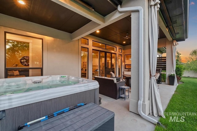 2165 N Luge Ave, Eagle, ID 83616 - patio terrace at dusk with a hot tub and a patio