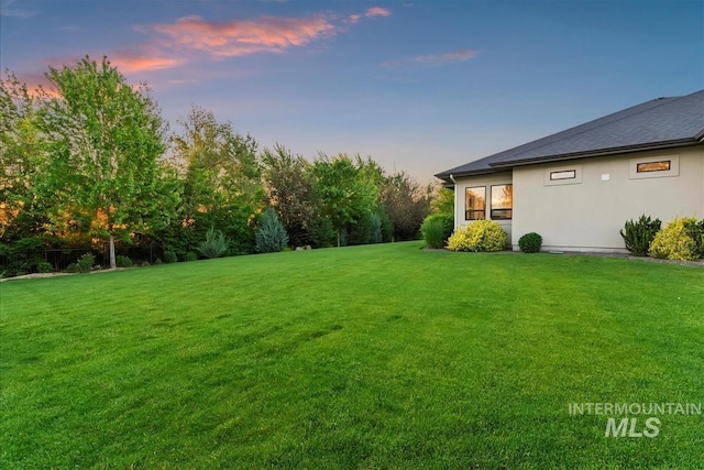 2165 N Luge Ave, Eagle, ID 83616 - yard at dusk with a lawn