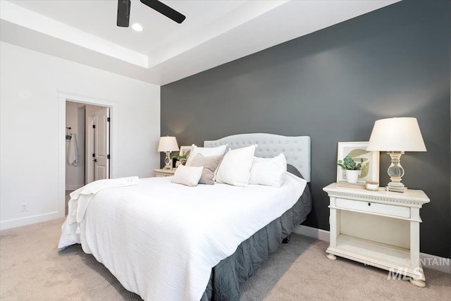 carpeted bedroom featuring ceiling fan and baseboards