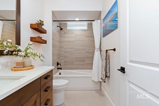 bathroom with shower / bath combination with curtain, tile patterned flooring, vanity, and toilet