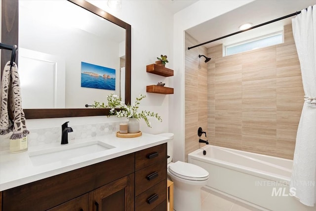 full bath featuring shower / bath combination with curtain, tile patterned flooring, vanity, and toilet