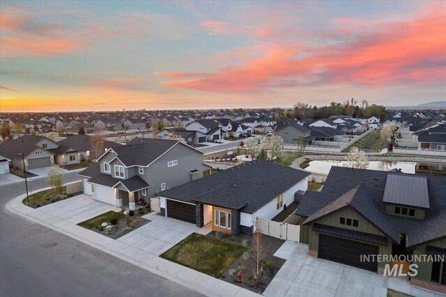 aerial view at dusk with a residential view