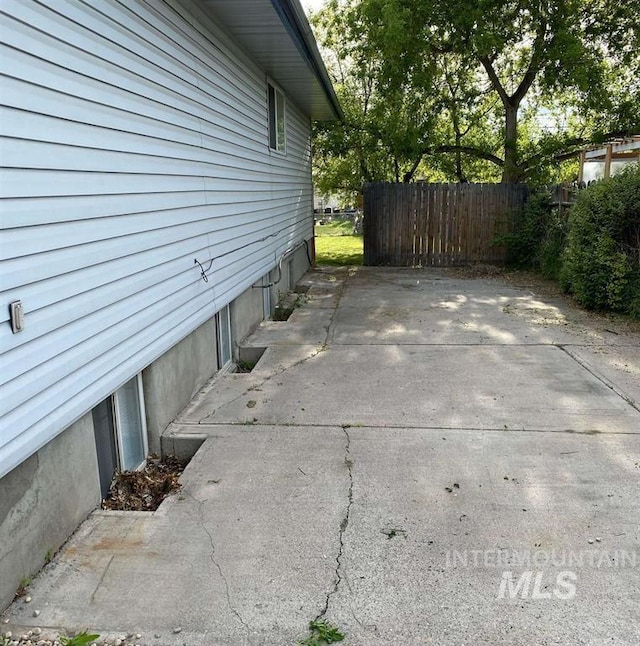 view of side of property with a patio