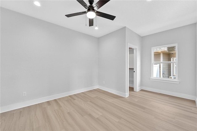 unfurnished room featuring ceiling fan and light wood-type flooring