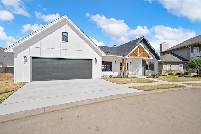 modern inspired farmhouse with a garage