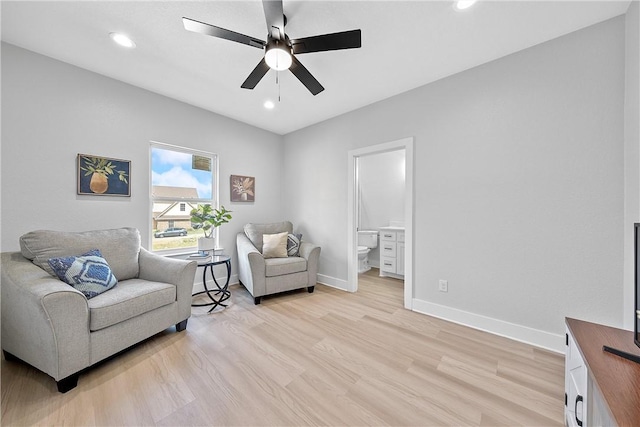 living area featuring ceiling fan and light wood-type flooring