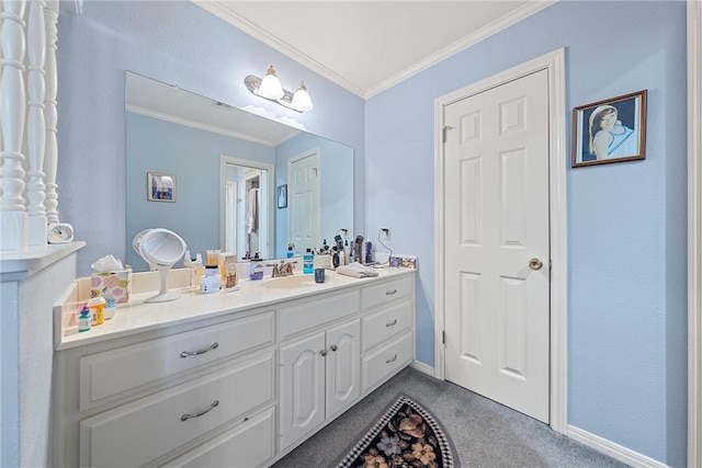 bathroom with baseboards, ornamental molding, and vanity