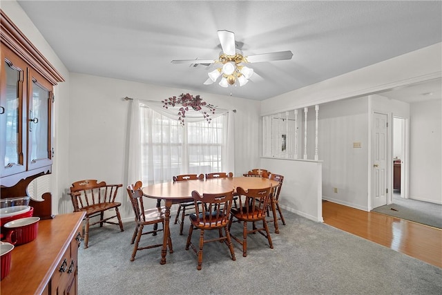 dining space featuring ceiling fan and light hardwood / wood-style flooring