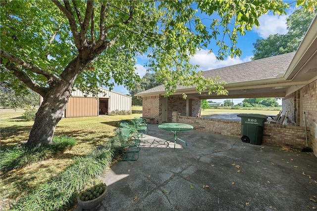 view of patio / terrace with an outdoor structure