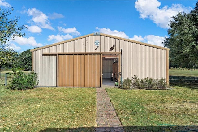 view of outdoor structure featuring a yard