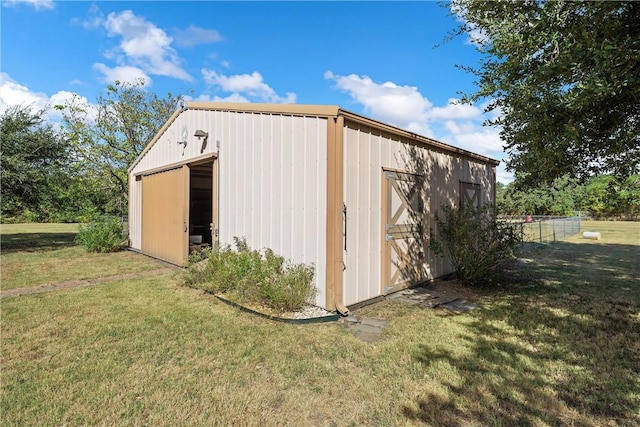 view of outdoor structure featuring a yard