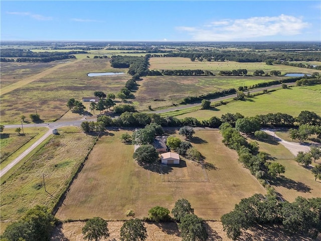 birds eye view of property with a rural view