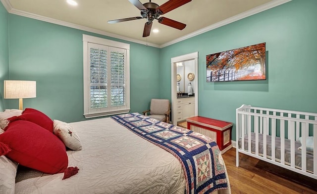 bedroom with hardwood / wood-style flooring, ceiling fan, ornamental molding, and ensuite bathroom