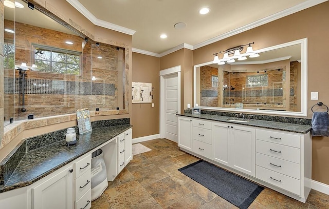 bathroom with tiled shower, vanity, and ornamental molding