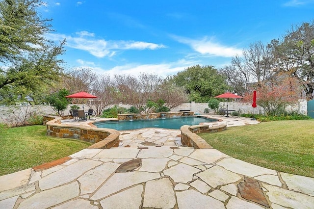 view of pool with a patio area and a yard