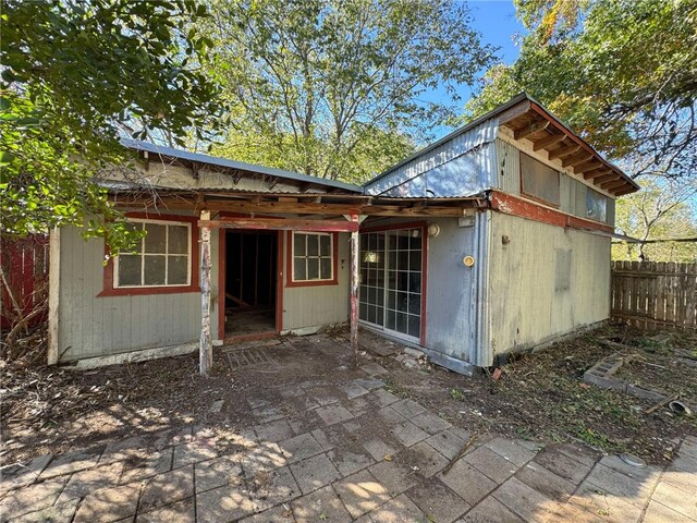 rear view of property featuring a patio