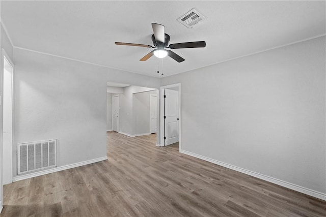 spare room featuring light hardwood / wood-style floors and ceiling fan