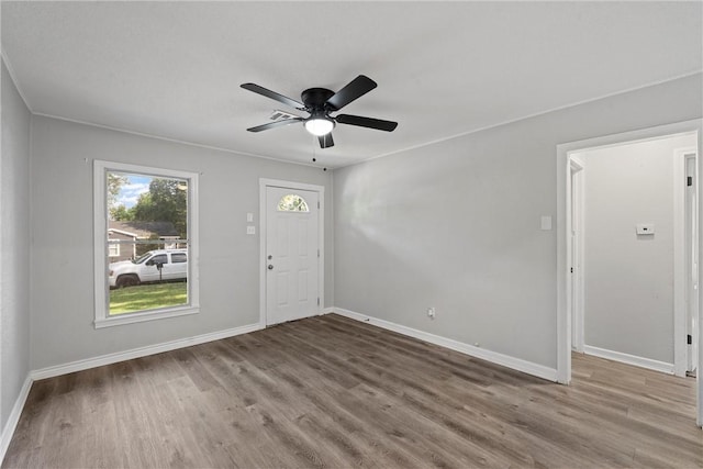 foyer entrance with ceiling fan and hardwood / wood-style floors