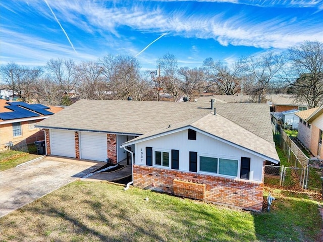 ranch-style house with a front lawn and a garage