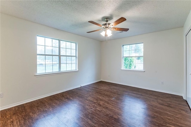 unfurnished room featuring ceiling fan, dark hardwood / wood-style flooring, and a textured ceiling