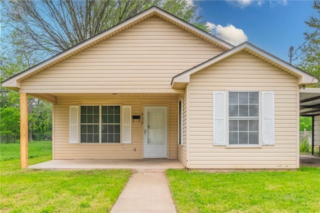 bungalow-style house with a front yard