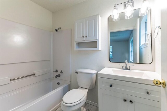 full bathroom featuring vanity,  shower combination, and toilet